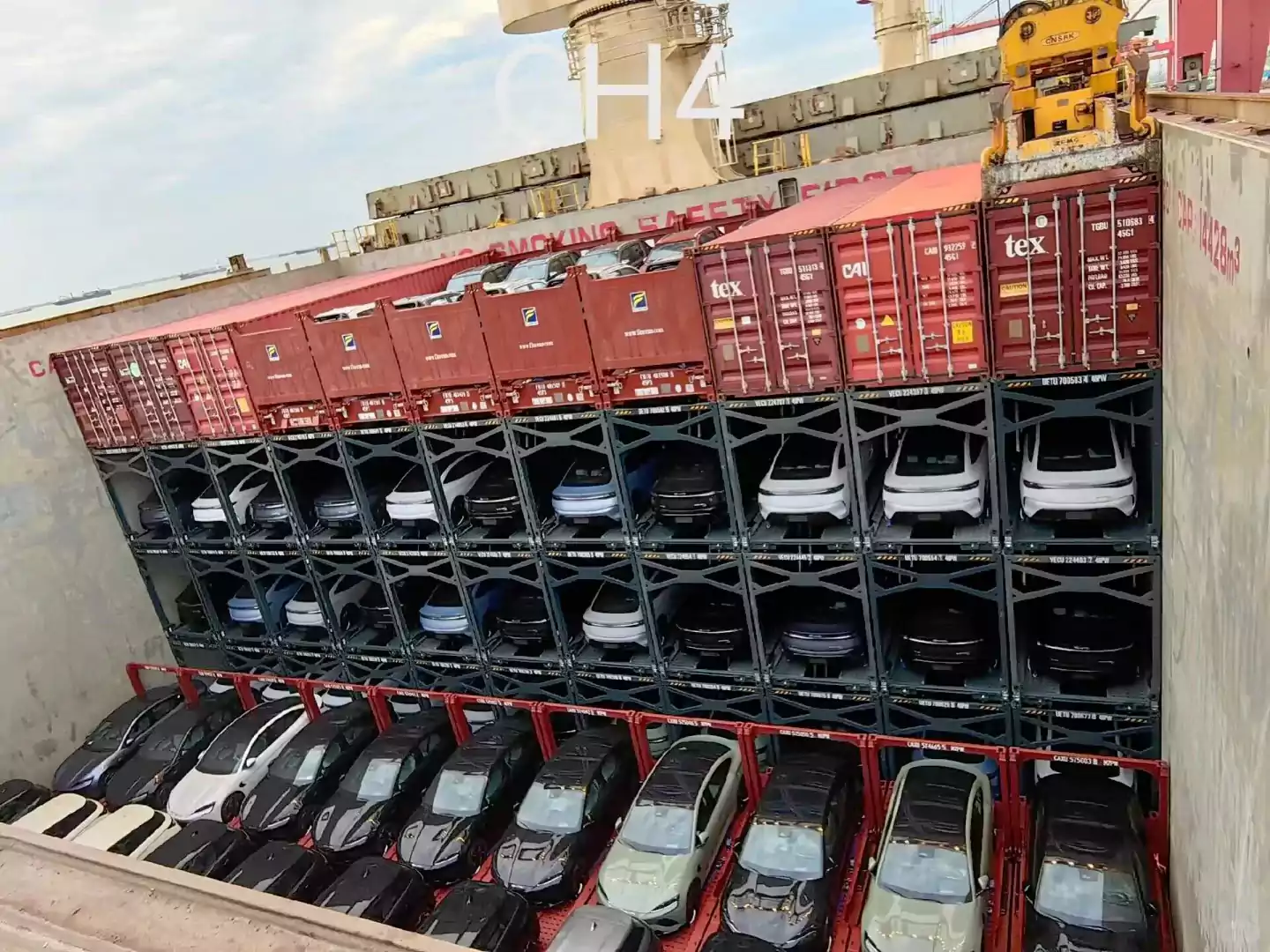 Cars loaded on frames aboard transport ships